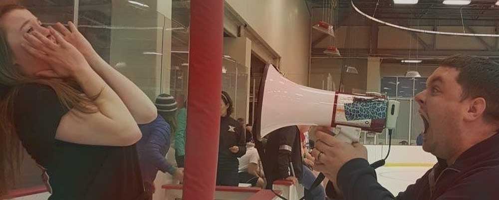 Jacob Mann yelling at a kid with a bullhorn